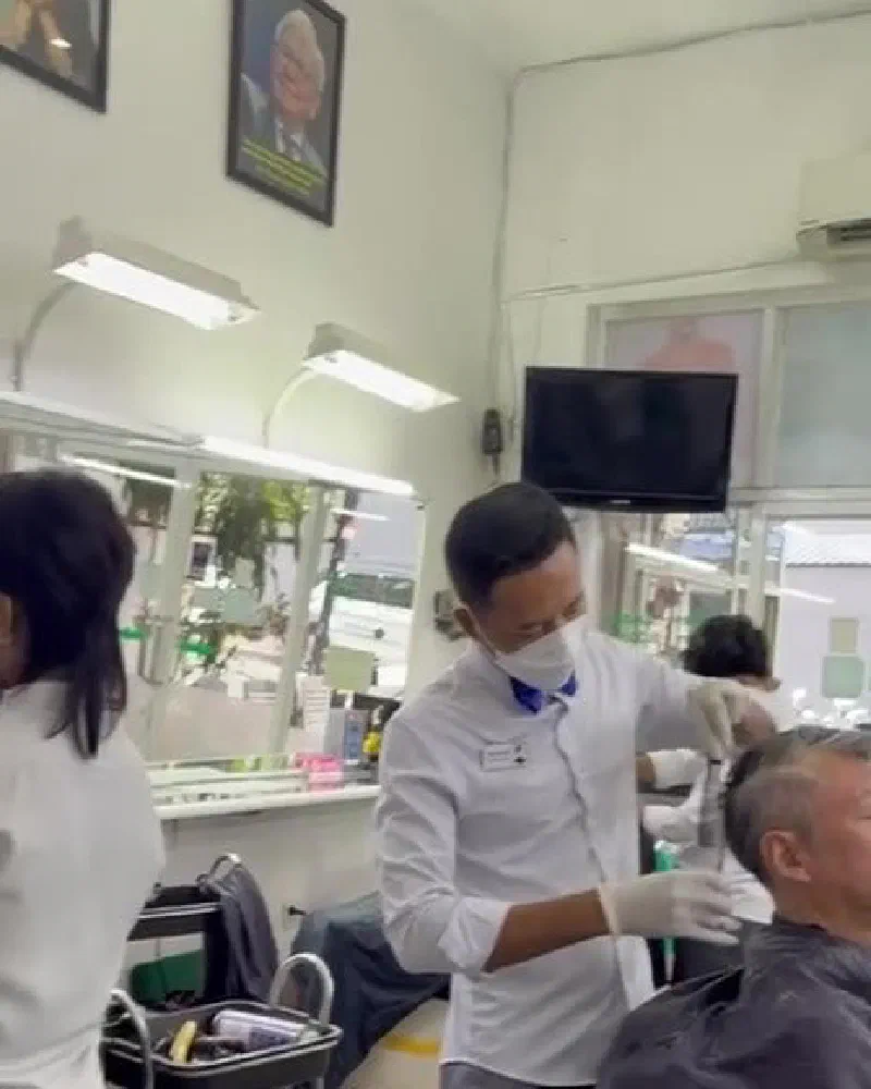 Barber giving a clipper fade at Tokyo Barber Shop, Phnom Penh